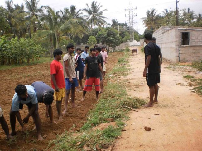 Seminarians work on reclaimed land in Bangalore