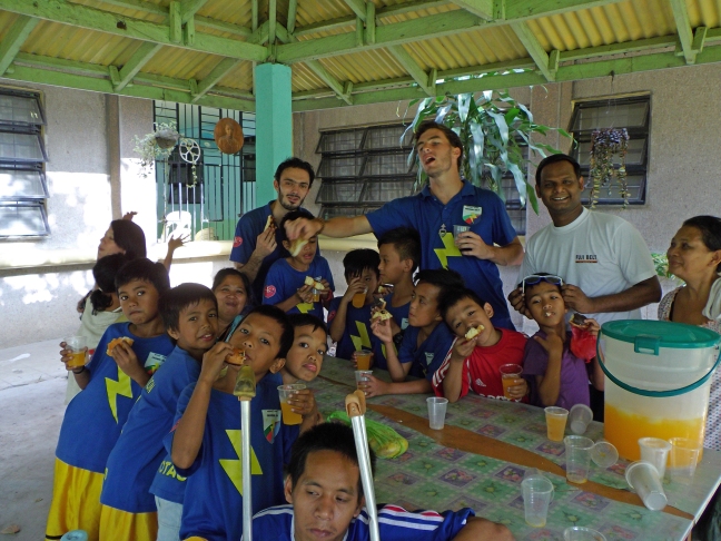 Bro. Joseph of the Servants of Charity with Filipino soccer kids.