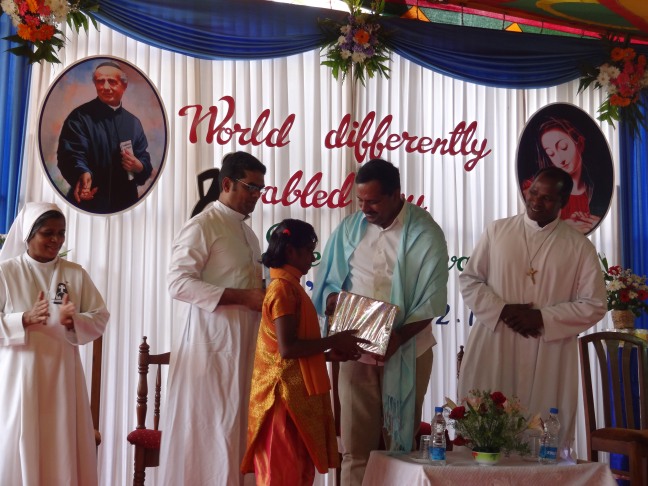Priests and dignitaries distribute awards